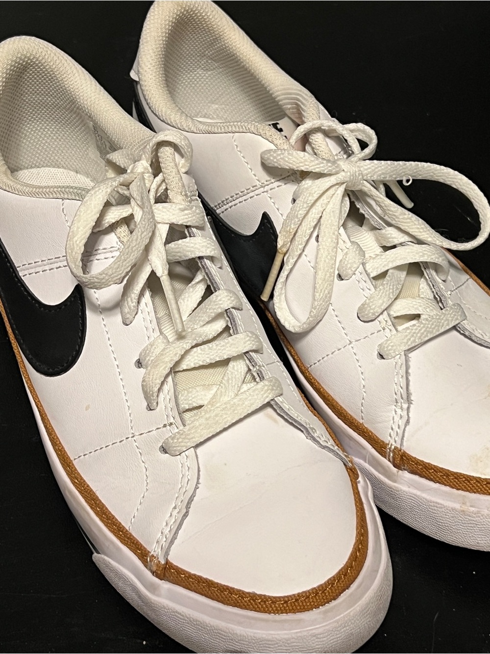 Nike White Sneakers with Black Swoosh and Brown Trim